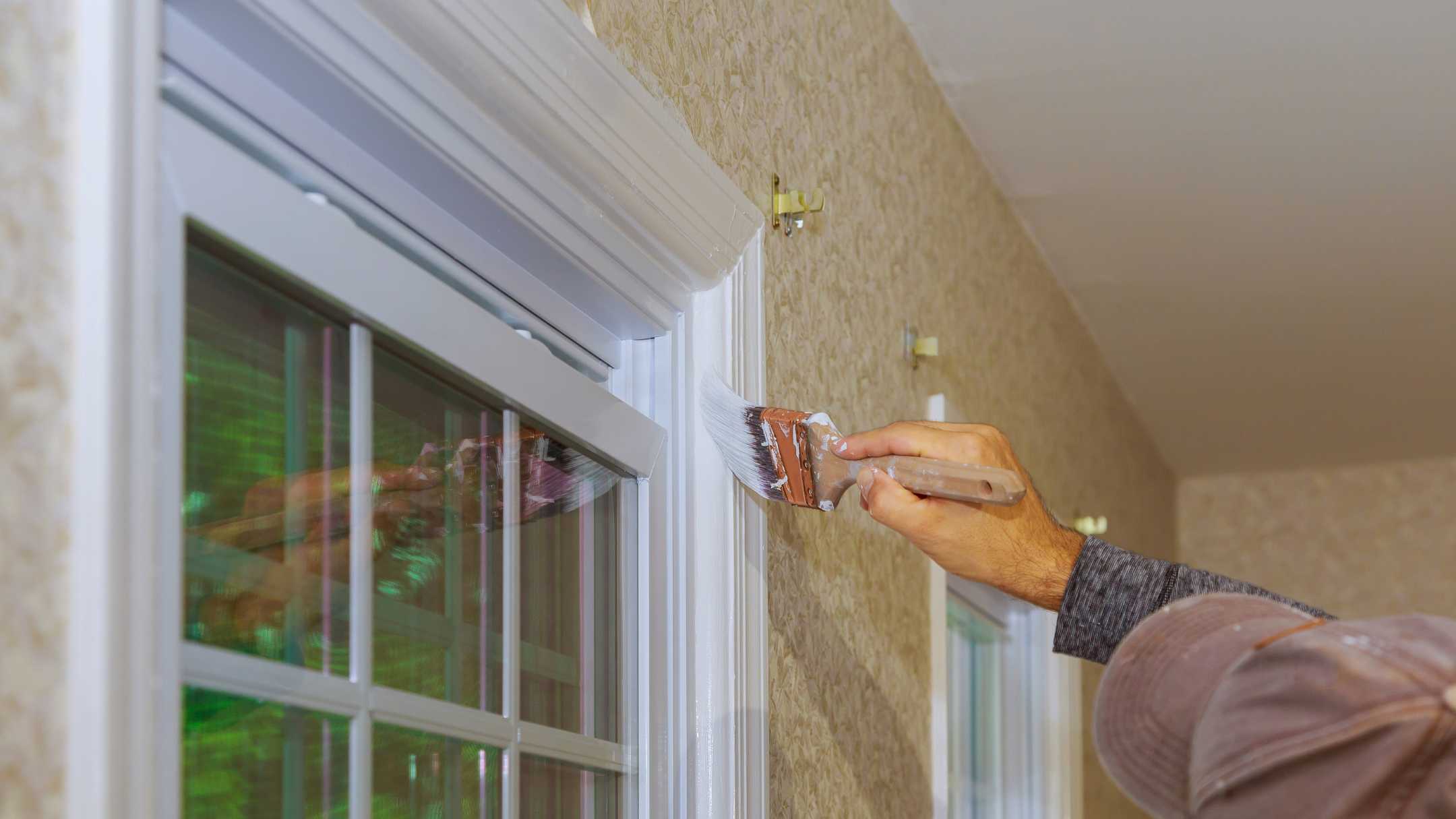 professional painting the trim of window seal