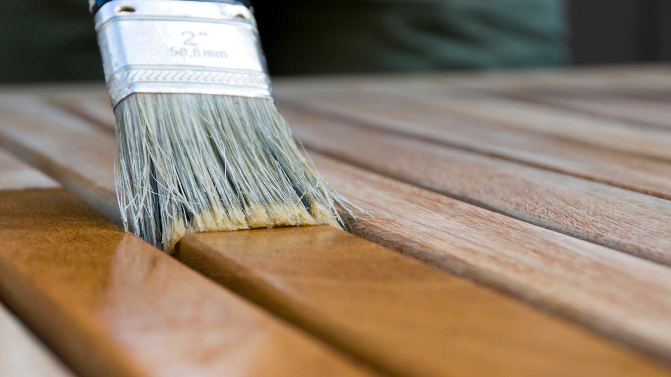 paint brush and wooden surface